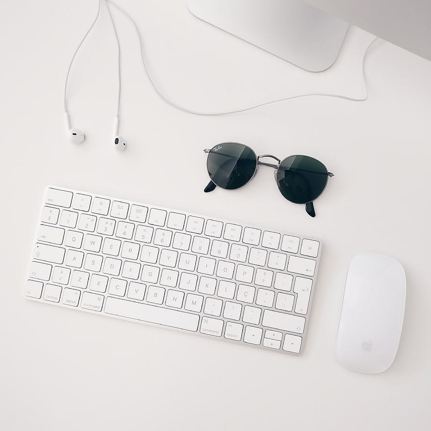 Minimalist home office workspace with plant and natural light
