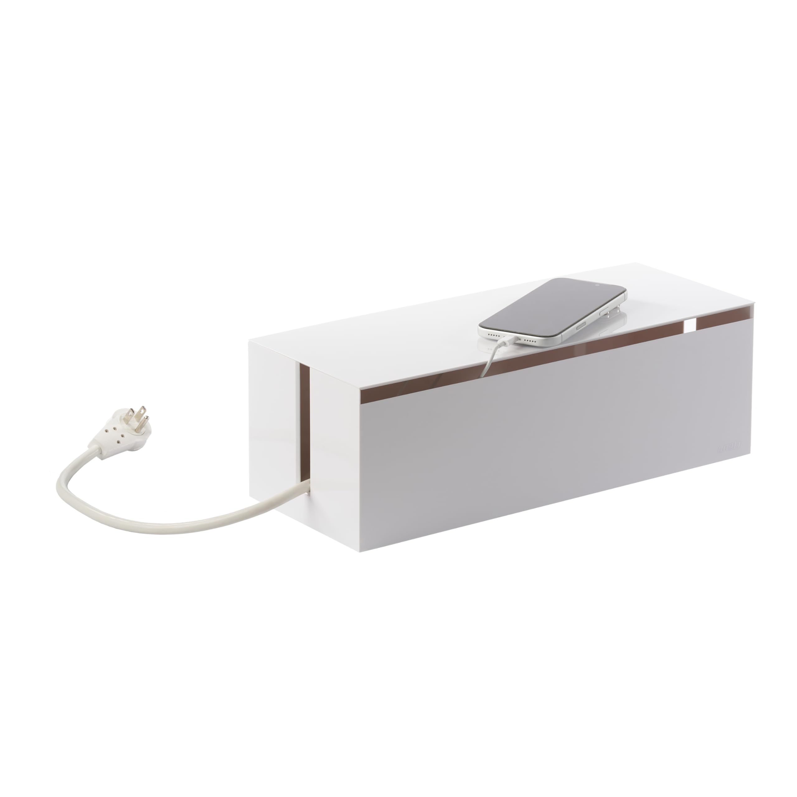 Minimalist white cable management box hiding cords on a desk
